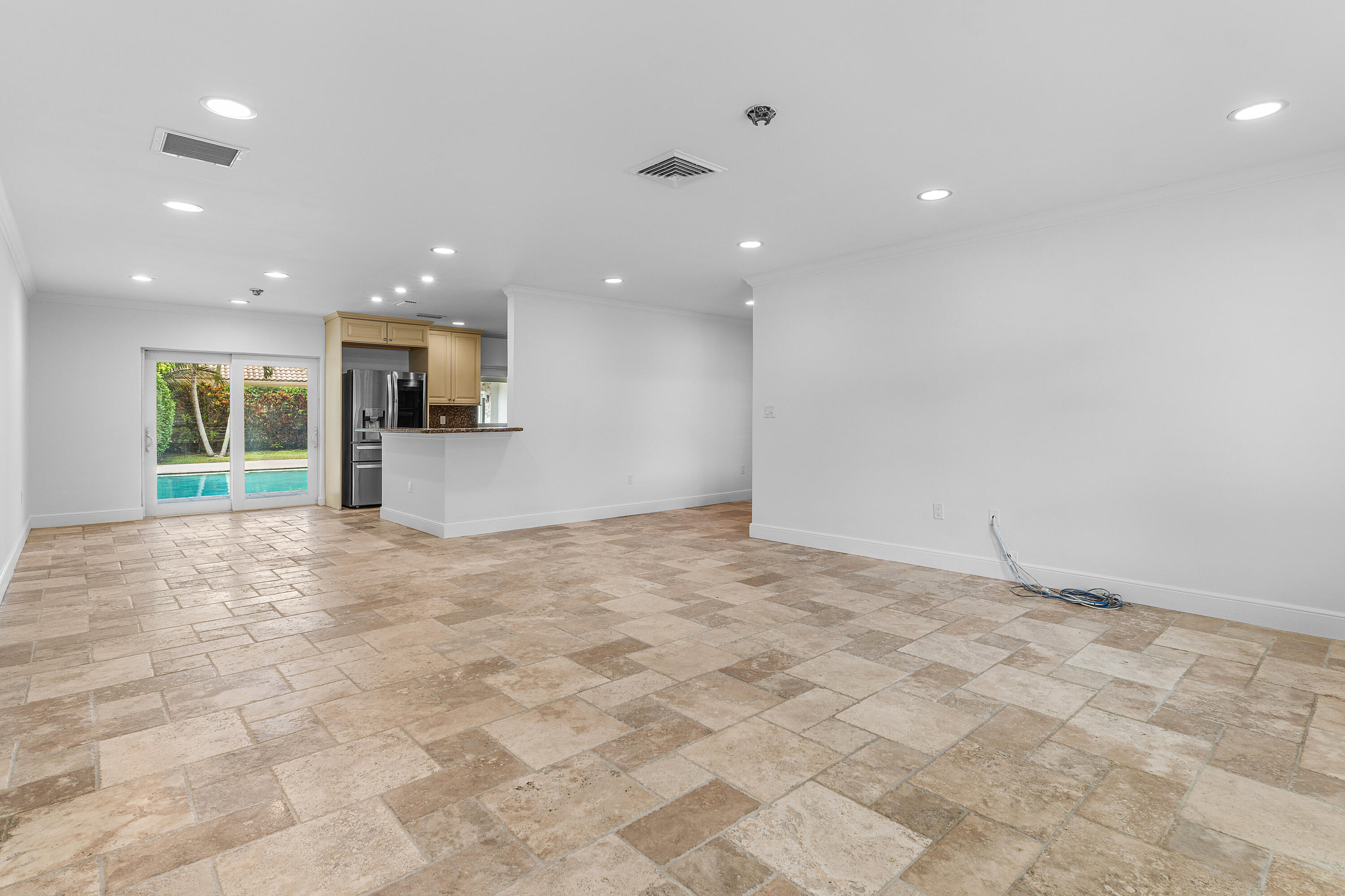783 Valencia Drive Boca Raton, FL 33432 - Photo 11 of 45 a view of a kitchen with a sink and a refrigerator