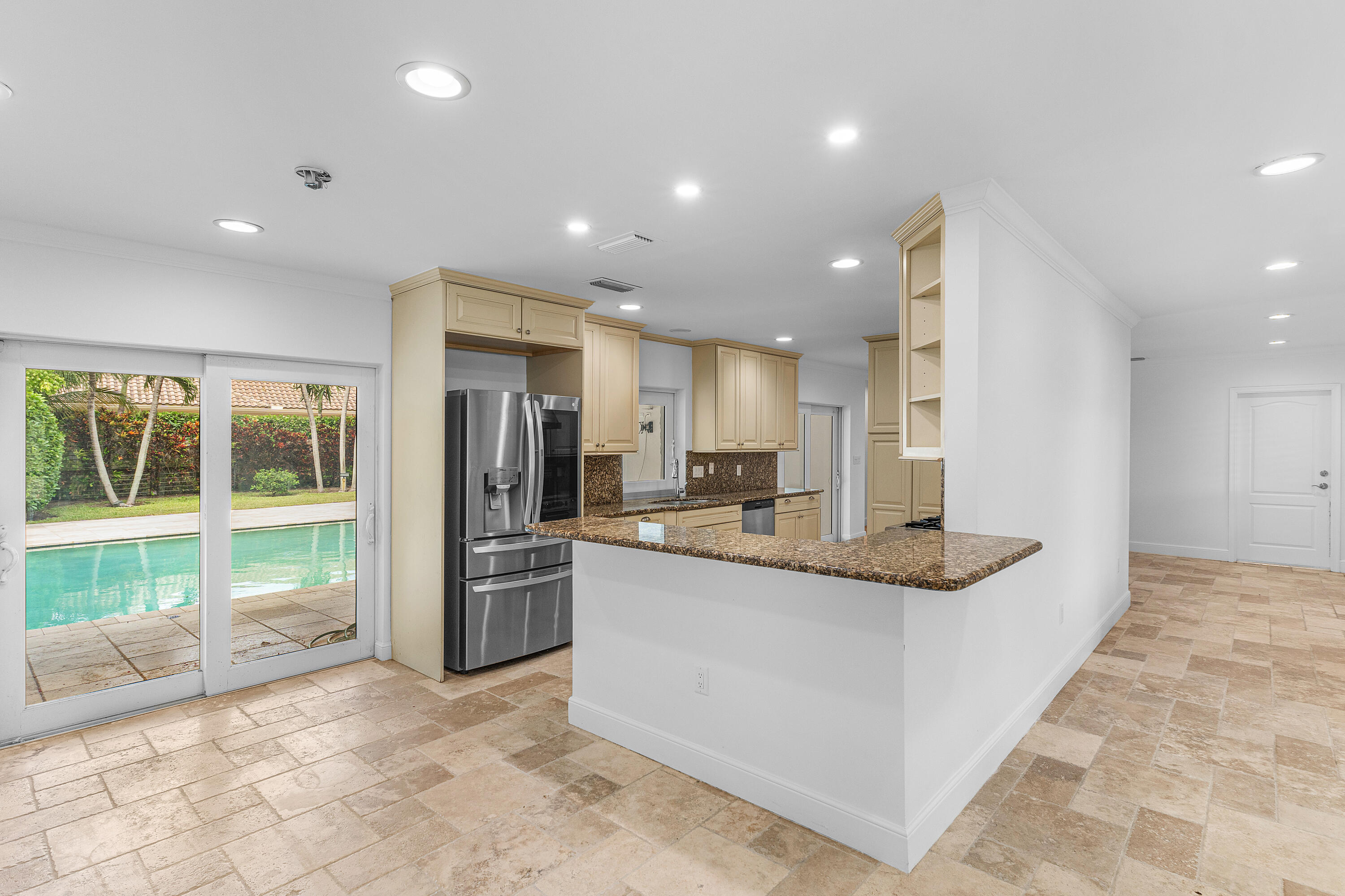 783 Valencia Drive Boca Raton, FL 33432 - Photo 12 of 45 a kitchen with stainless steel appliances granite countertop a refrigerator and a sink