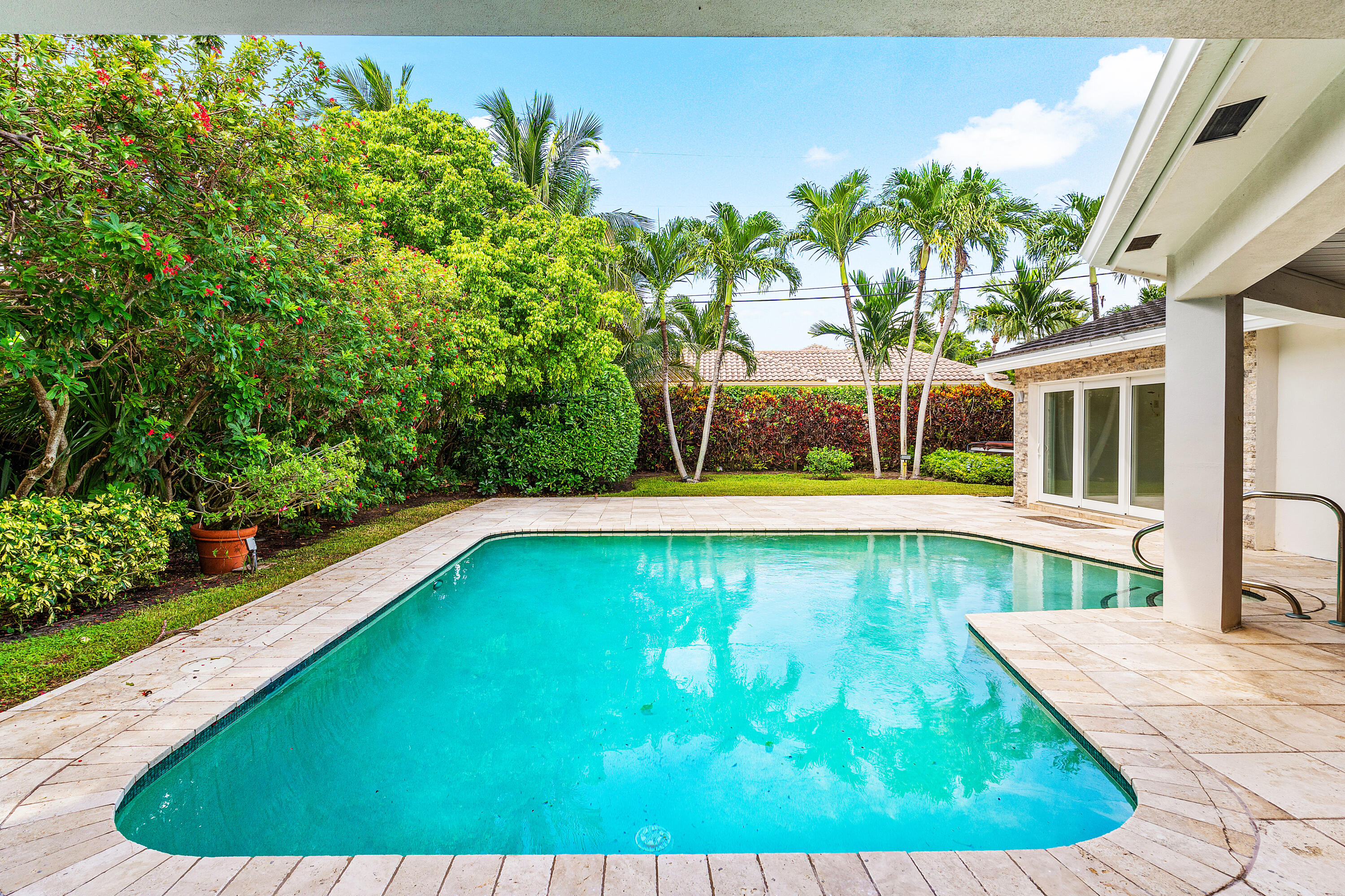 783 Valencia Drive Boca Raton, FL 33432 - Photo 20 of 45 a view of a swimming pool with a patio