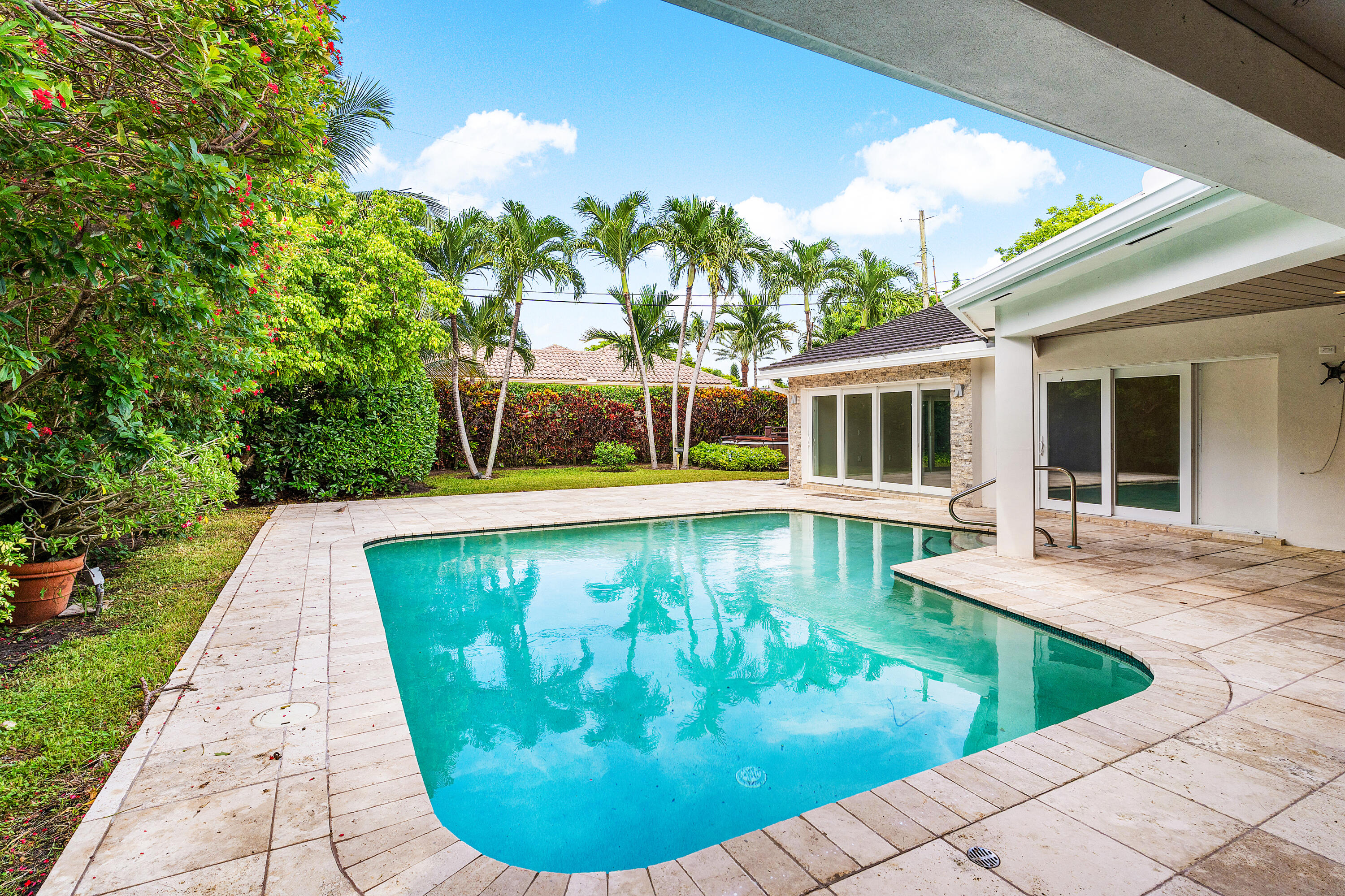 783 Valencia Drive Boca Raton, FL 33432 - Photo 21 of 45 a view of a swimming pool with a sitting space