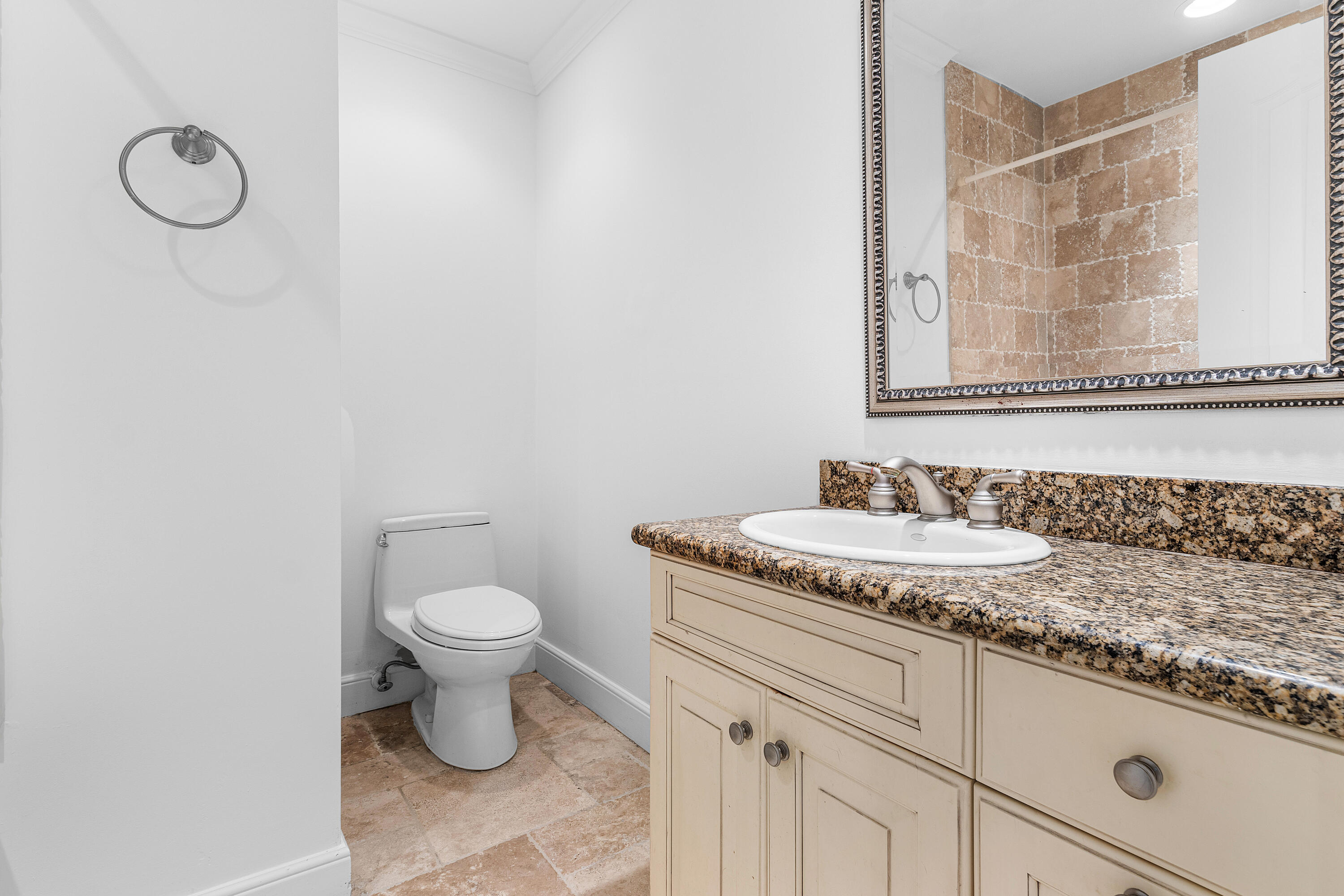 783 Valencia Drive Boca Raton, FL 33432 - Photo 30 of 45 a bathroom with a granite countertop sink and a toilet