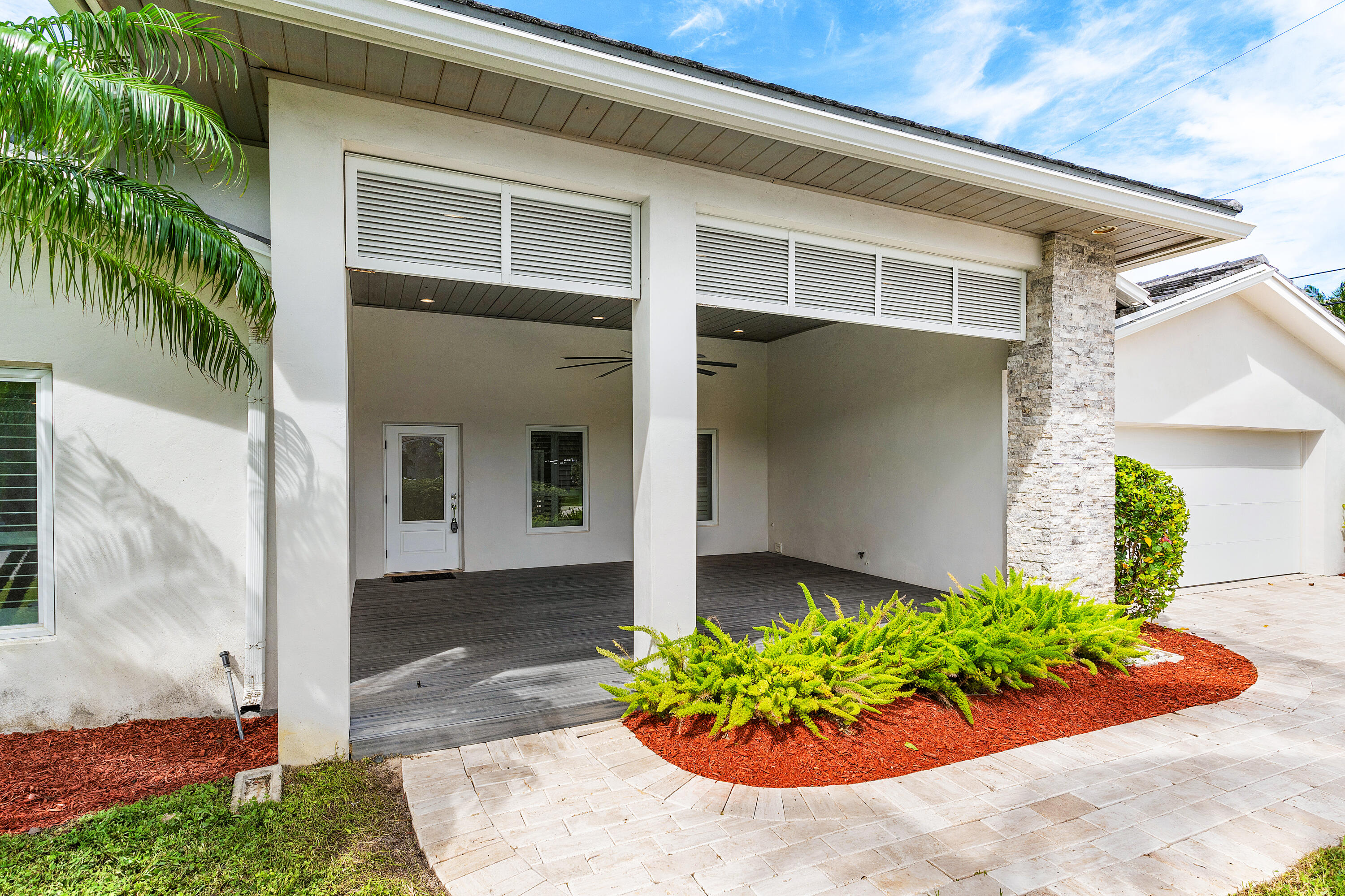 783 Valencia Drive Boca Raton, FL 33432 - Photo 4 of 45 a front view of a house with garden