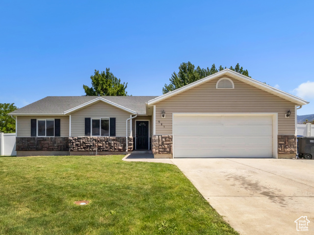 985 West 2675th Street South Logan, UT 84321 - Photo 1 of 1 Ranch-style home with a garage, driveway, and a mountain view