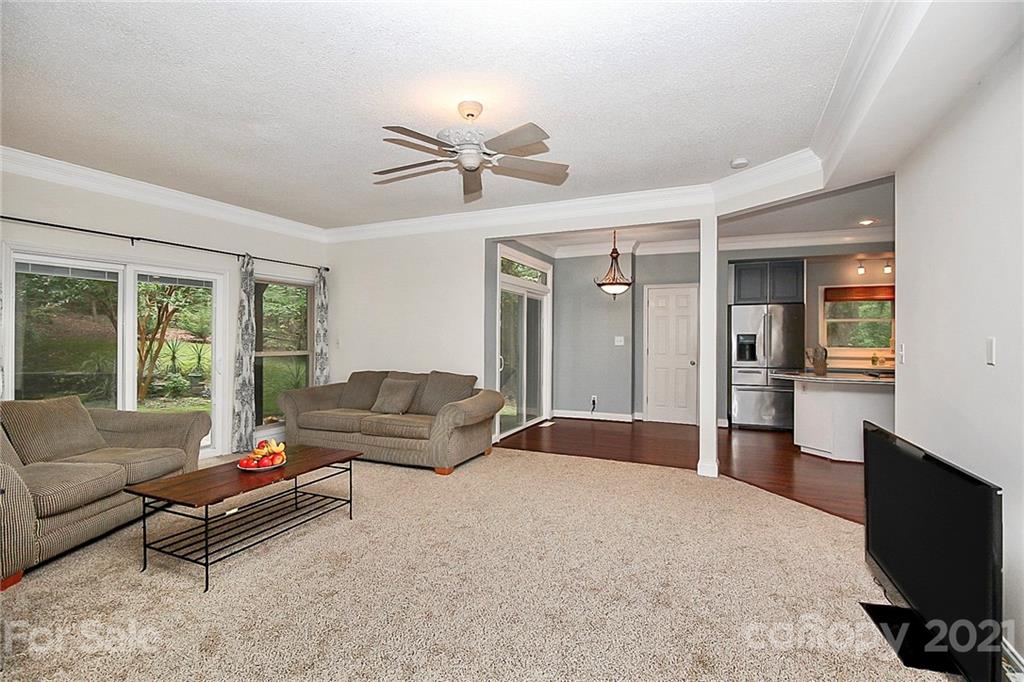 4900 Spring Lane Charlotte, NC 28213 - Photo 14 of 31 a living room with furniture and a flat screen tv