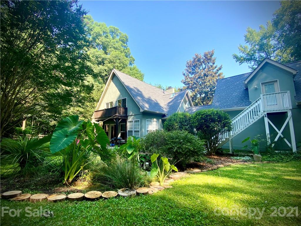4900 Spring Lane Charlotte, NC 28213 - Photo 3 of 31 a view of a house with a backyard