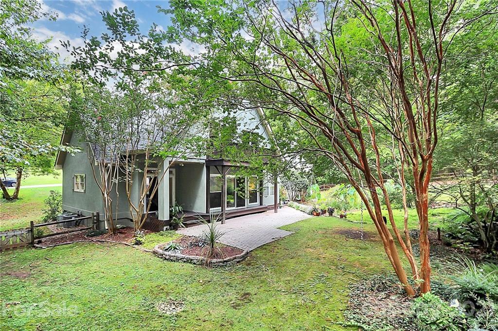 4900 Spring Lane Charlotte, NC 28213 - Photo 22 of 31 a view of a backyard with large trees
