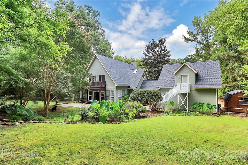 4900 Spring Lane Charlotte, NC 28213 - Photo 23 of 31 a front view of a house with a yard