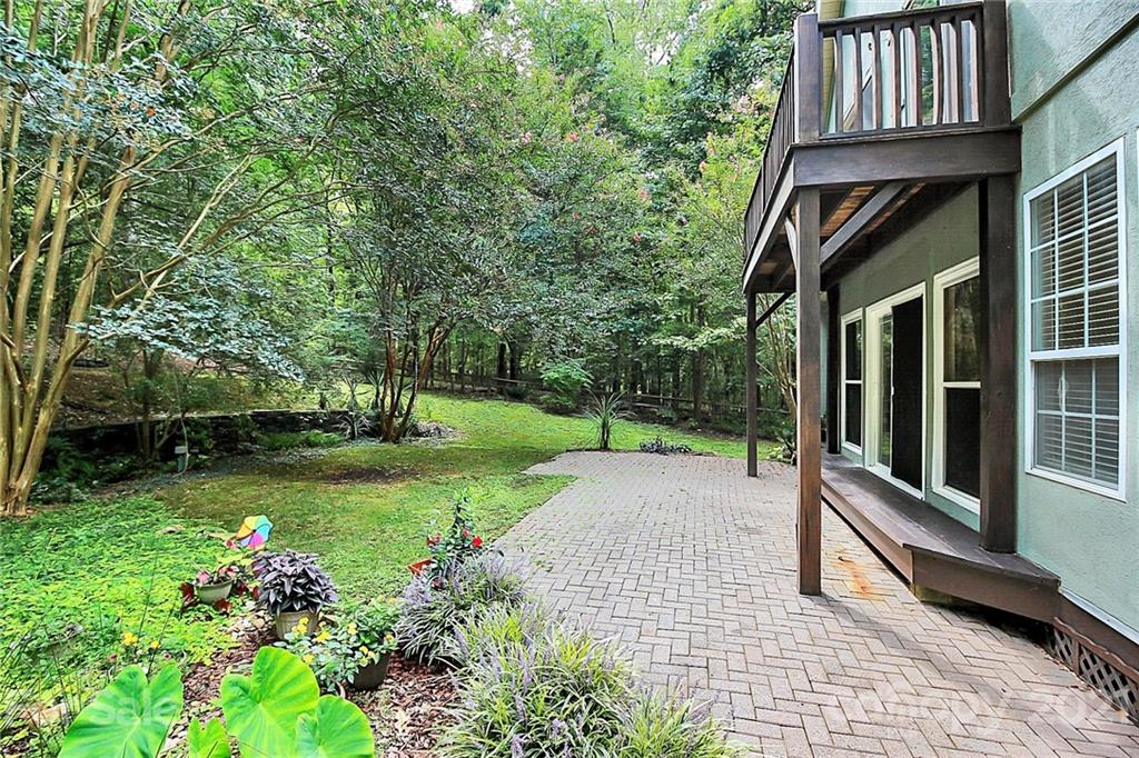 4900 Spring Lane Charlotte, NC 28213 - Photo 25 of 31 a view of a house with backyard and garden