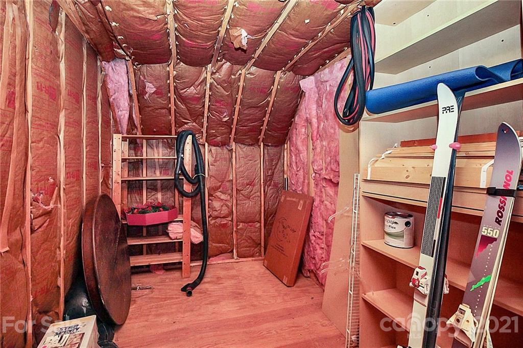 4900 Spring Lane Charlotte, NC 28213 - Photo 27 of 31 a view of walk in closet with clothes and shoes