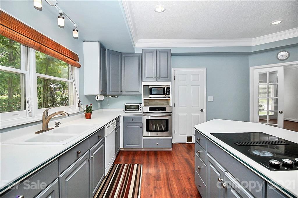 4900 Spring Lane Charlotte, NC 28213 - Photo 9 of 31 a kitchen with a sink stove and refrigerator