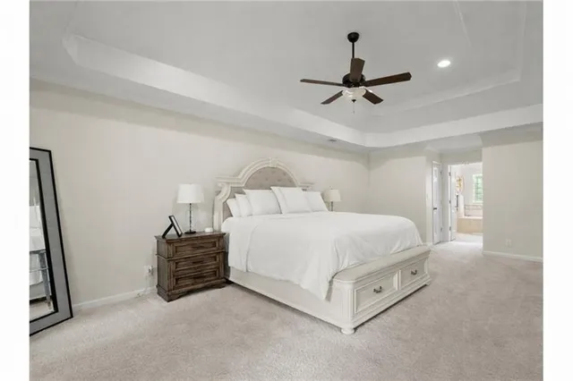a utility room with cabinets washer and dryer