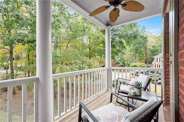 an empty room with a ceiling fan and a window