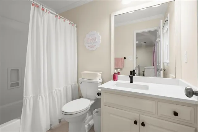 a living room with furniture and a projector screen