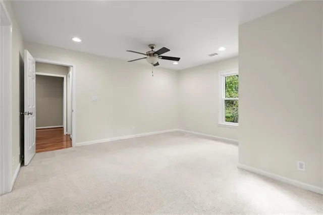 a view of a patio with table and chairs and wooden floor