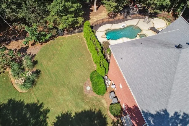 a view of a dining room with furniture wooden floor and chandelier