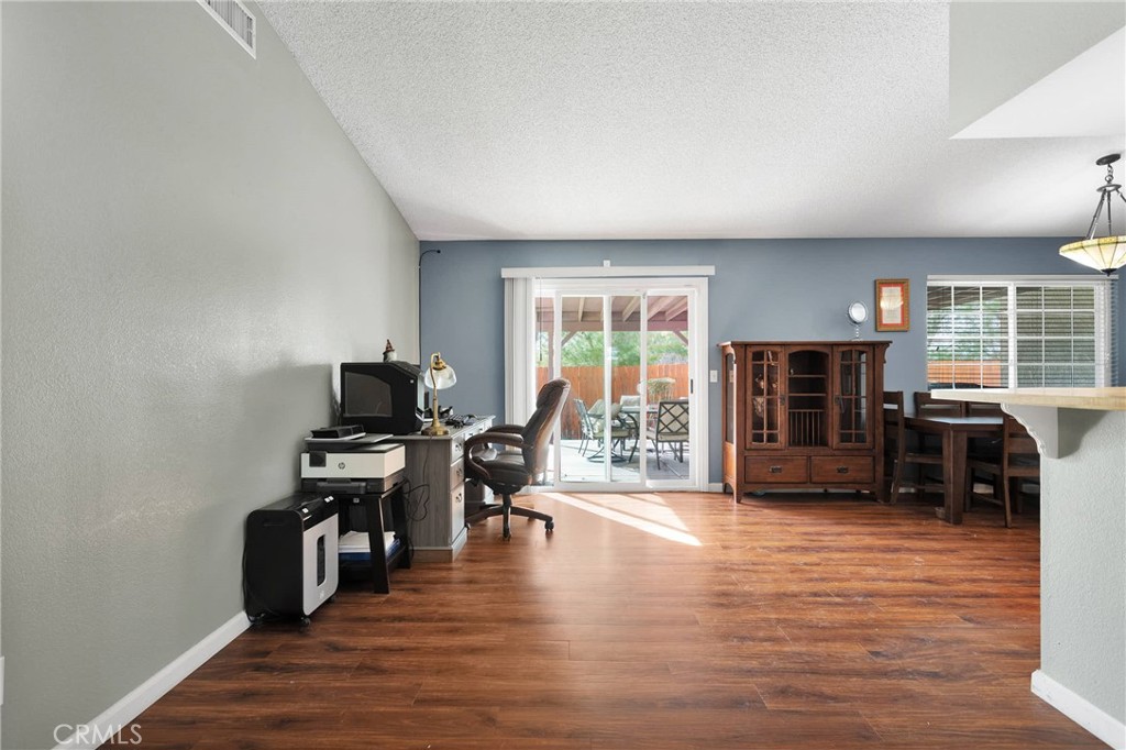 14190 Tehachapi Road Apple Valley, CA 92307 - Photo 11 of 39 a living room with furniture and a flat screen tv