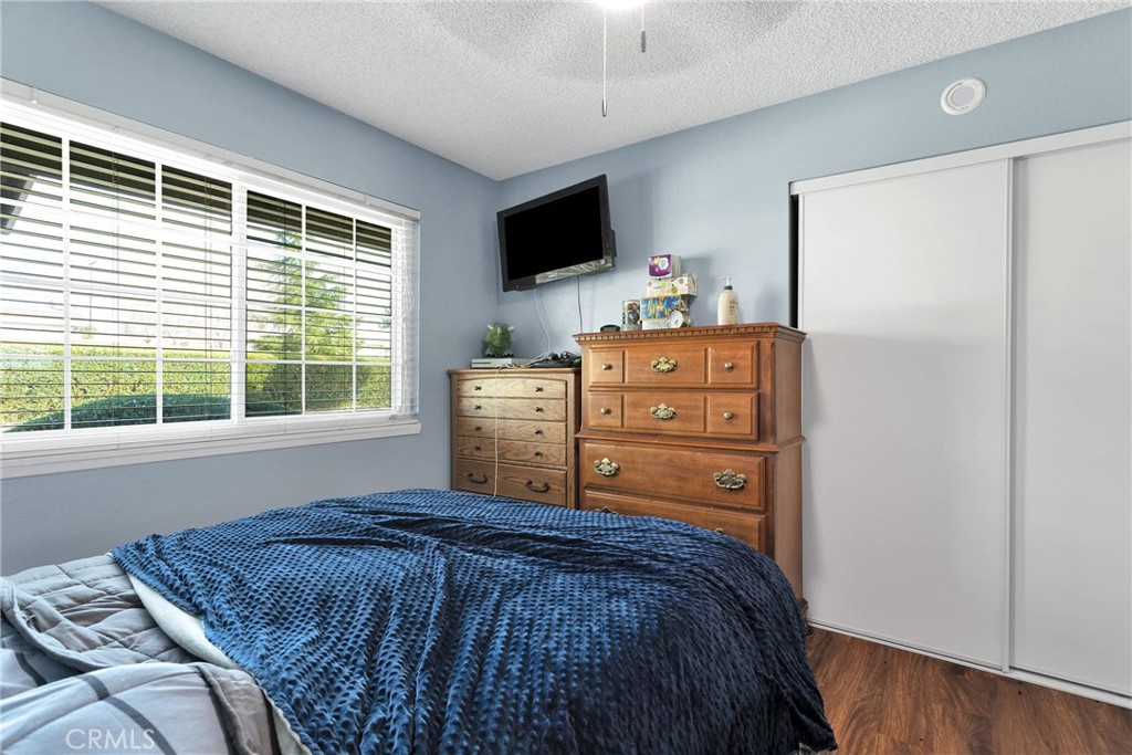 14190 Tehachapi Road Apple Valley, CA 92307 - Photo 27 of 39 a bed sitting in a bedroom next to a window