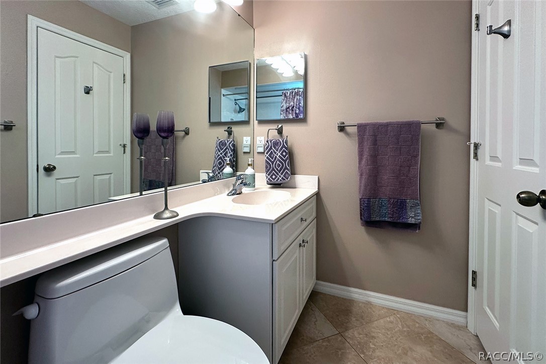 800 Balmoral Court Inverness, FL 34453 - Photo 32 of 72 a bathroom with a sink vanity and a mirror