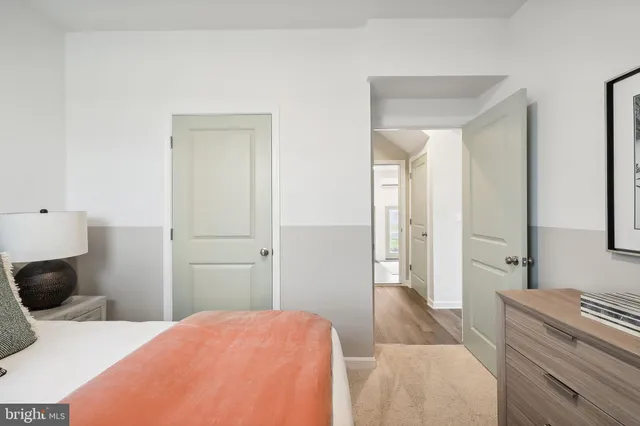 a bedroom with a bed and a couch