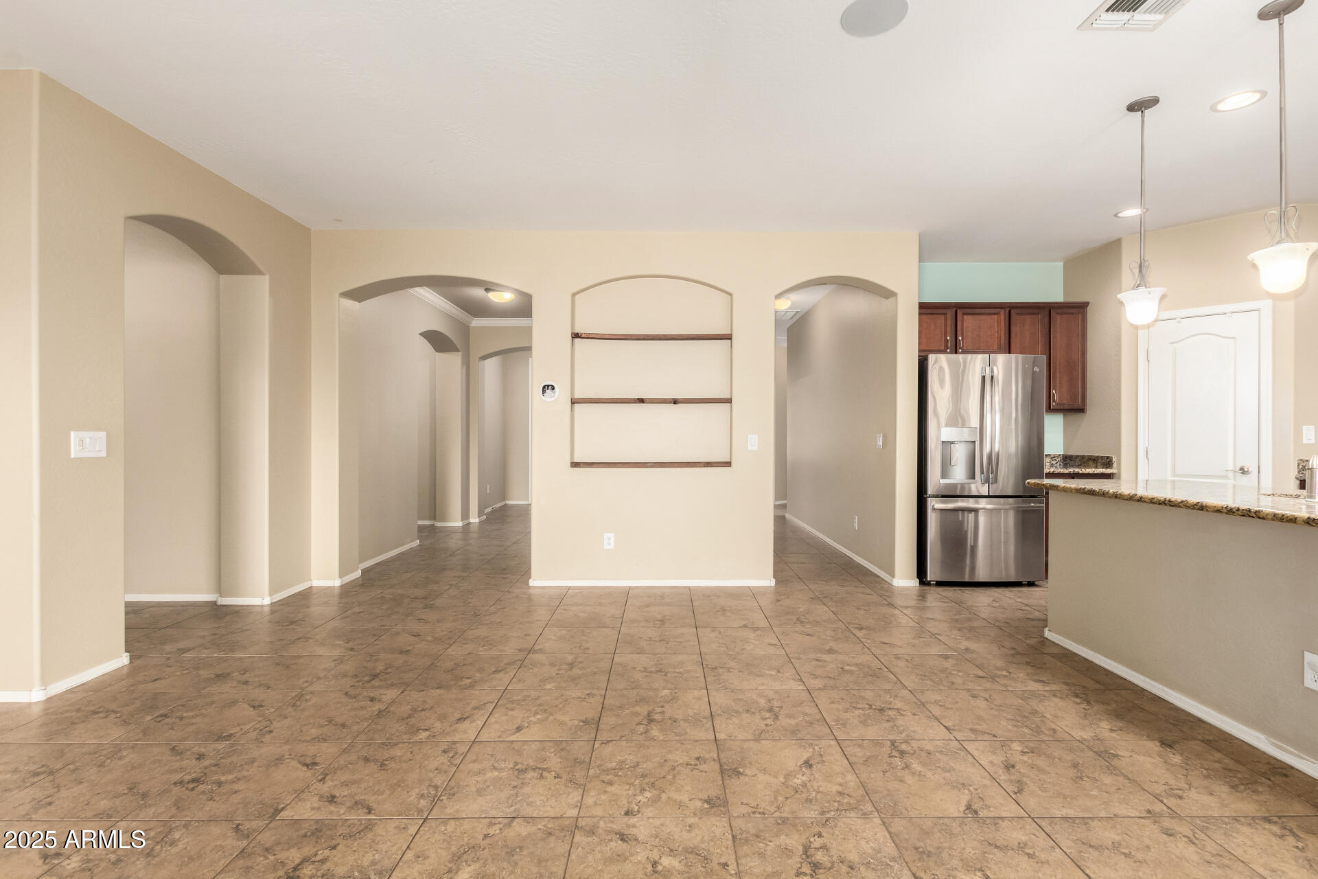 2806 East Trigger Way Gilbert, AZ 85297 - Photo 11 of 40 a view of a kitchen with a sink and stainless steel appliances