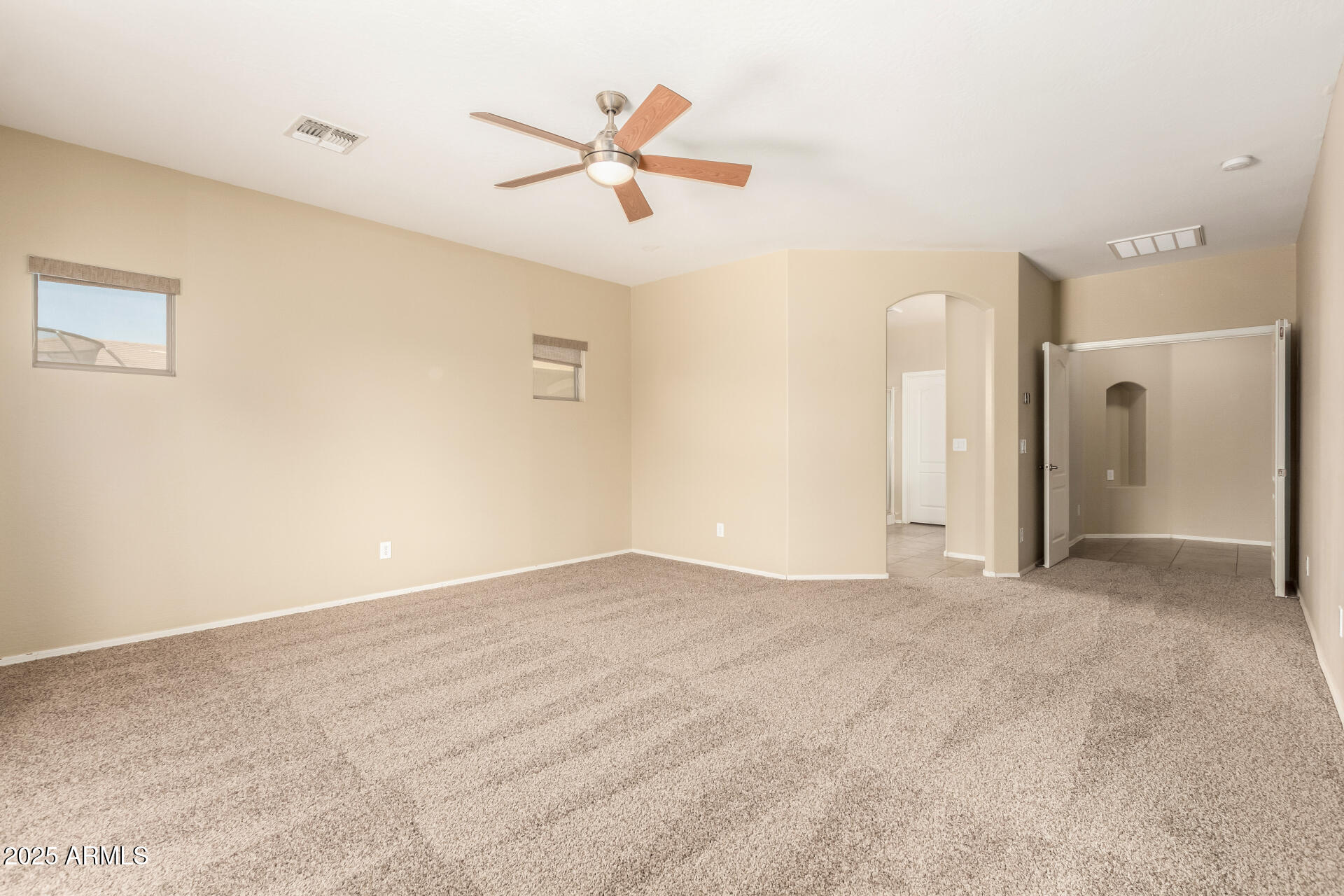 2806 East Trigger Way Gilbert, AZ 85297 - Photo 19 of 40 a view of a livingroom with a ceiling fan and window