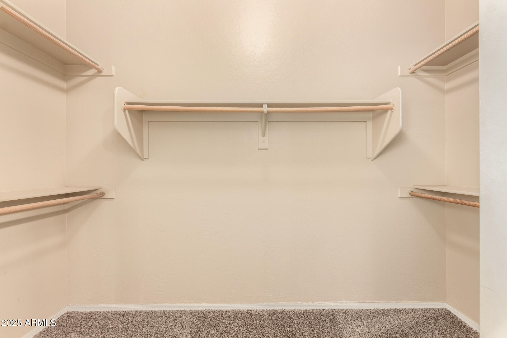 2806 East Trigger Way Gilbert, AZ 85297 - Photo 24 of 40 a view of walk in closet with empty racks