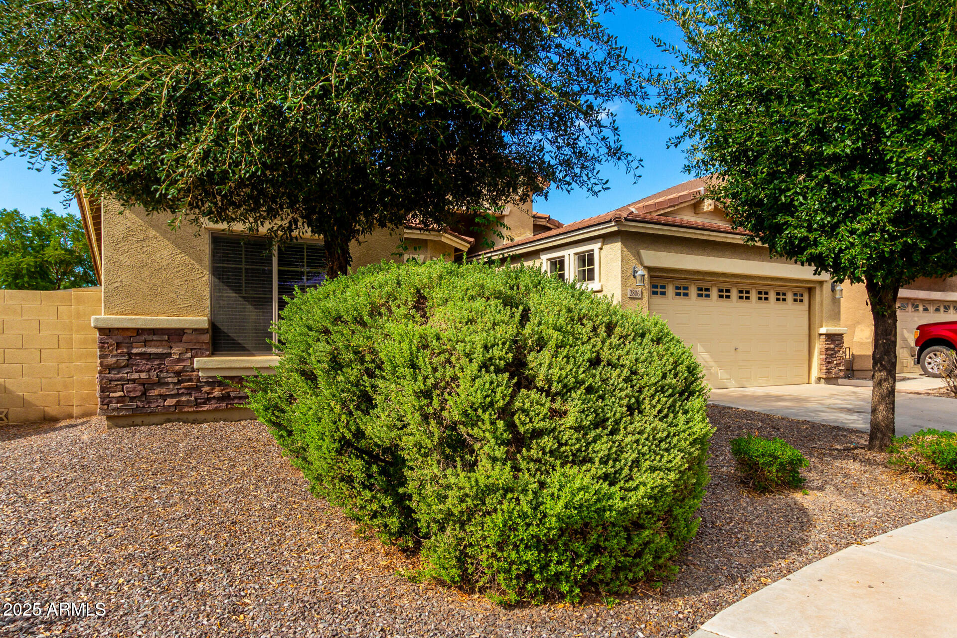 2806 East Trigger Way Gilbert, AZ 85297 - Photo 6 of 40 a front view of a house with garden