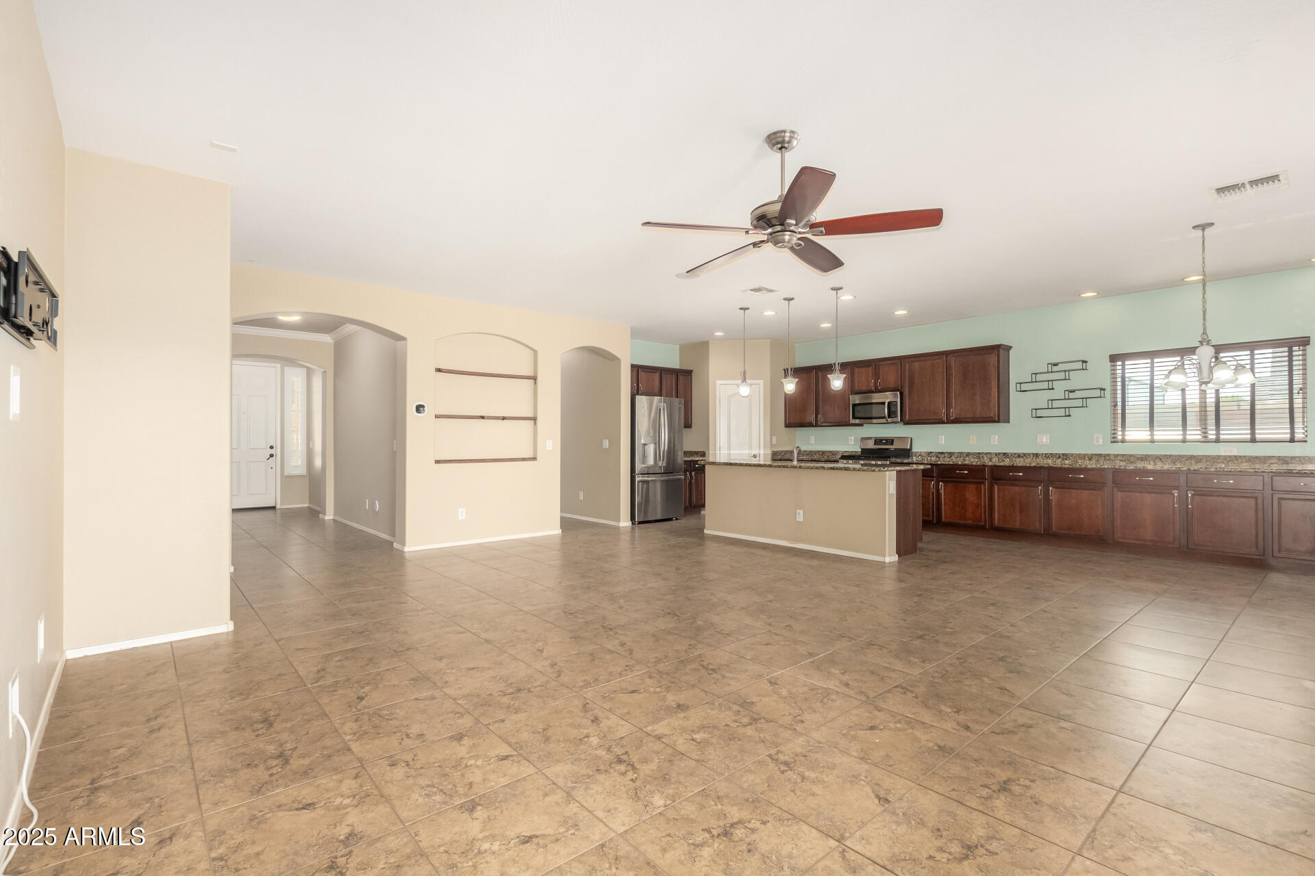 2806 East Trigger Way Gilbert, AZ 85297 - Photo 9 of 40 a view of a kitchen with a sink and a refrigerator