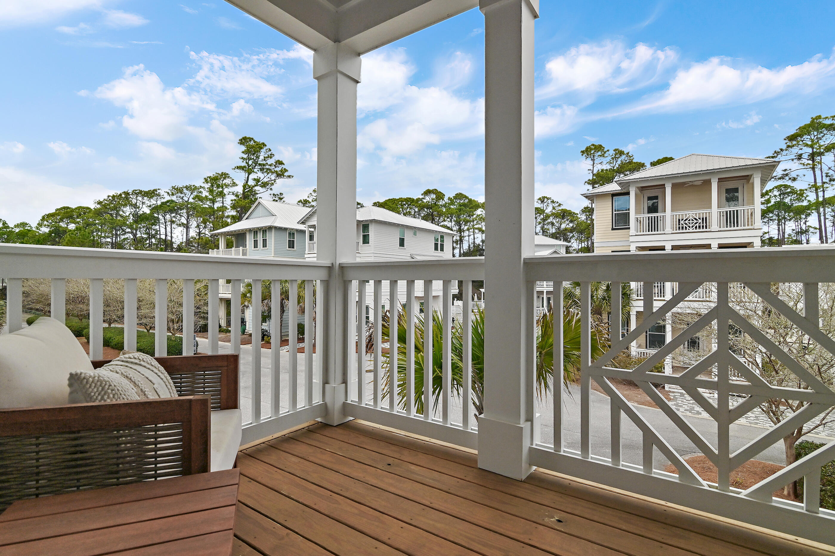 171 Redbud Ln Inlet Beach Inlet Beach, FL 32461 - Photo 20 of 37 a view of a balcony with chairs and wooden floor
