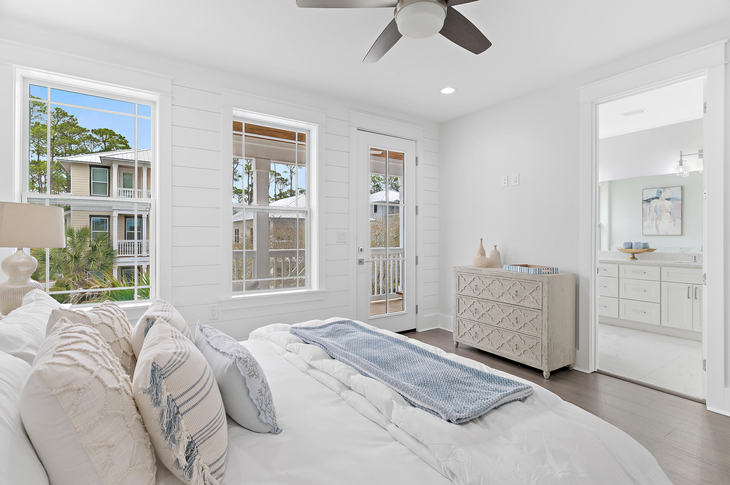171 Redbud Ln Inlet Beach Inlet Beach, FL 32461 - Photo 21 of 37 a spacious bedroom with a large bed and a chandelier