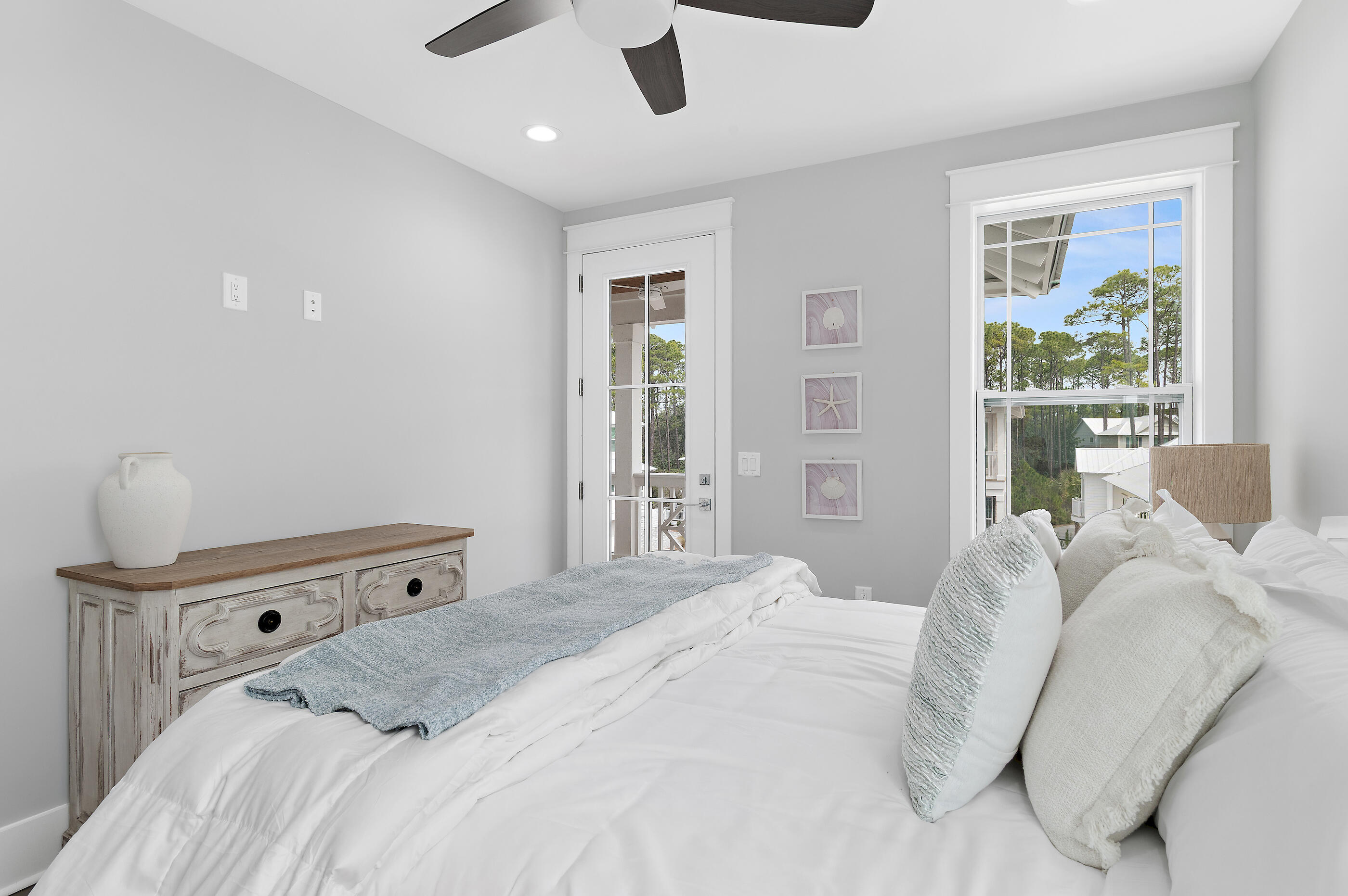 171 Redbud Ln Inlet Beach Inlet Beach, FL 32461 - Photo 27 of 37 a bedroom with a bed and large windows