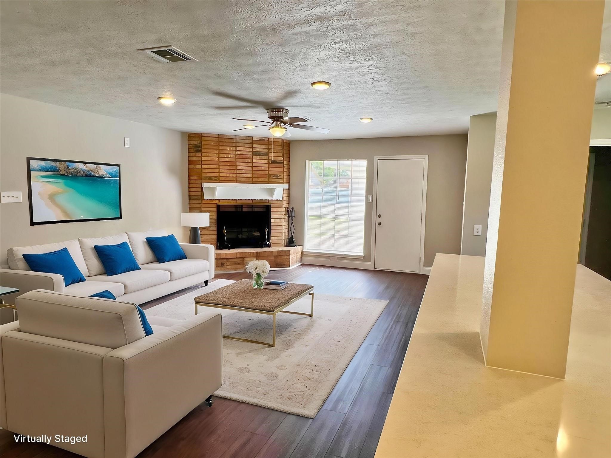 415 Sevenhampton Lane Houston, TX 77015 - Photo 7 of 32 a living room with furniture and a large window
