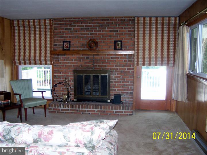 224 Friendship Road Southampton, NJ 08088 - Photo 5 of 11 a living room with furniture and a fireplace