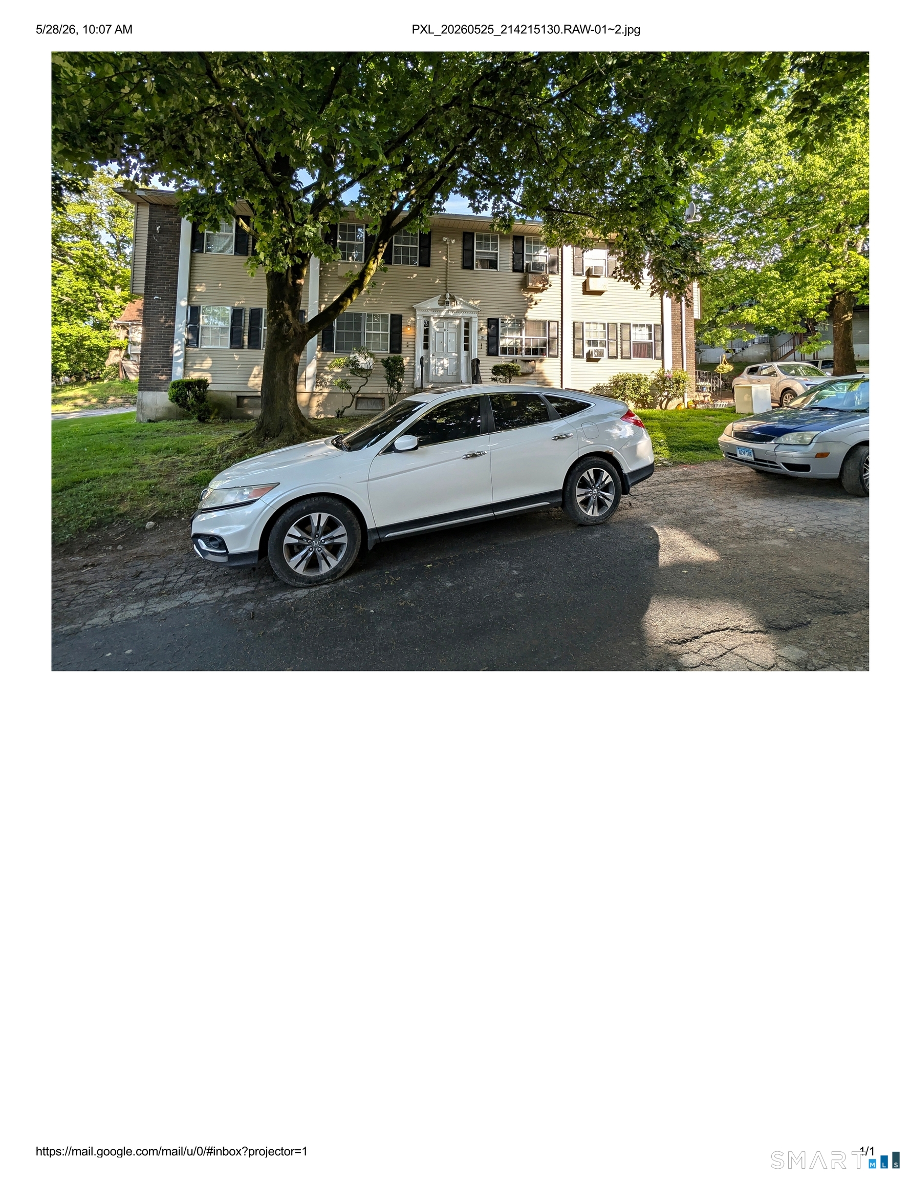 62 Angel Drive, Unit A Waterbury, CT 06708 - Photo 2 of 11 a view of a cars park in front of a house