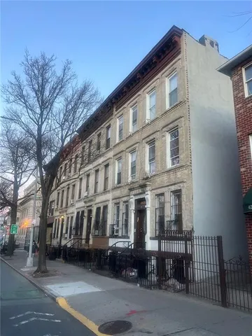a view of a building with a street