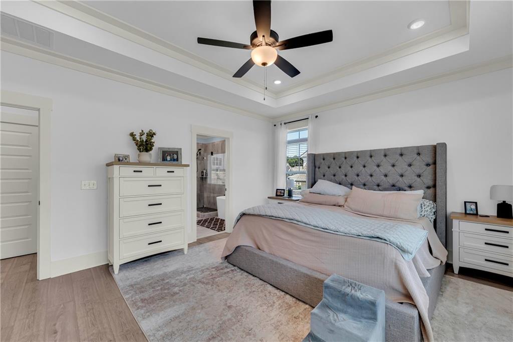 943 Clubside Drive Monroe, GA 30655 - Photo 12 of 24 a bedroom with a bed and a ceiling fan