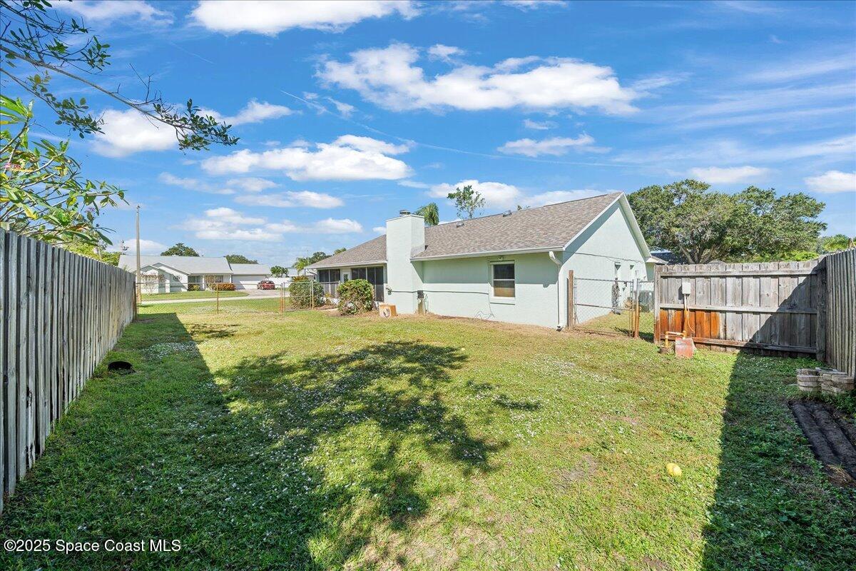 875 Evergreen Place Rockledge, FL 32955 - Photo 23 of 27 a view of an house with backyard and garden