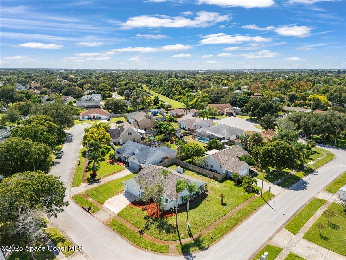 875 Evergreen Place Rockledge, FL 32955 - Photo 27 of 27 an aerial view of residential houses with outdoor space