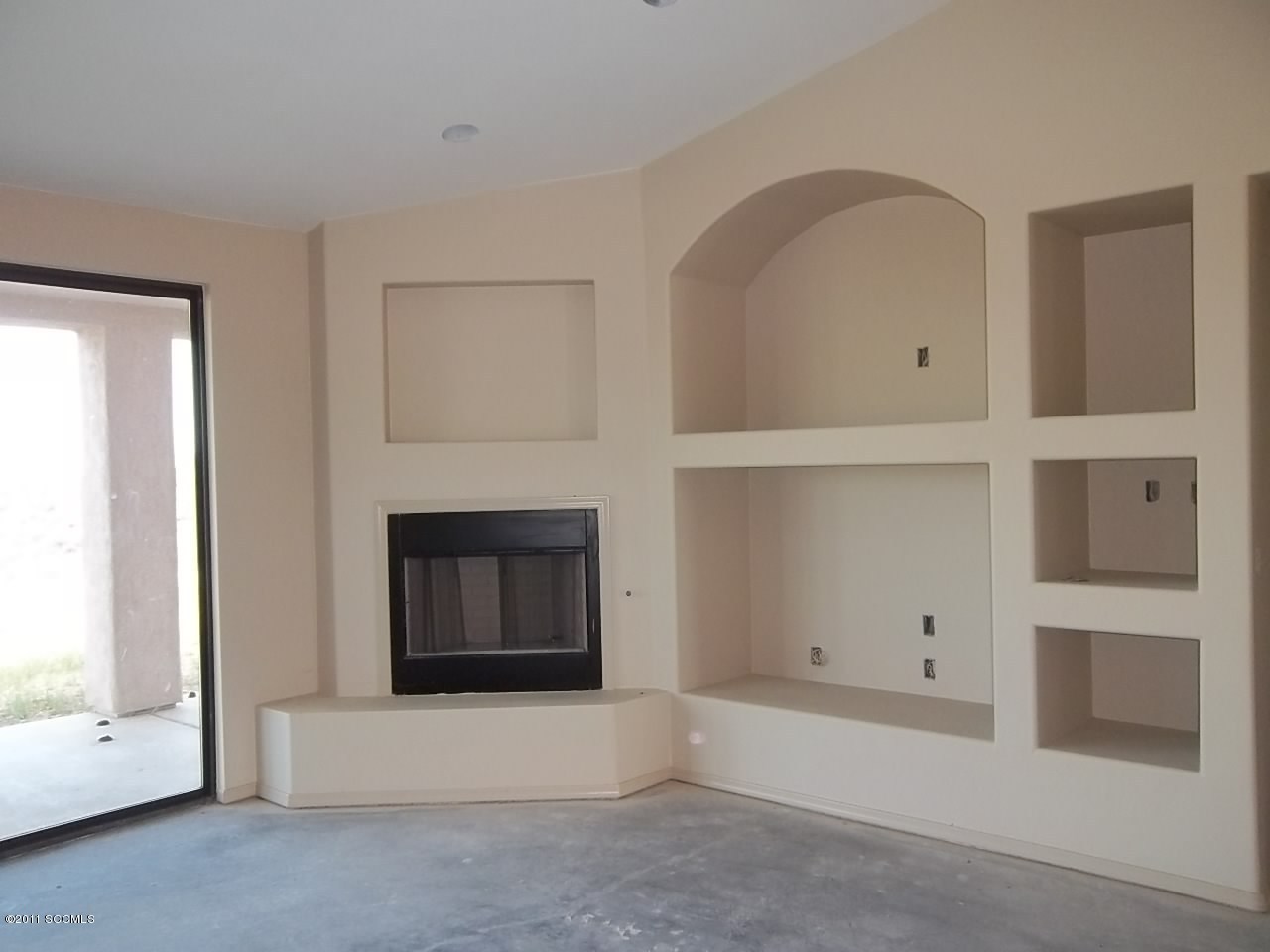 1502 Ola Court Rio Rico, AZ 85648 - Photo 7 of 15 a living room with furniture and a fireplace
