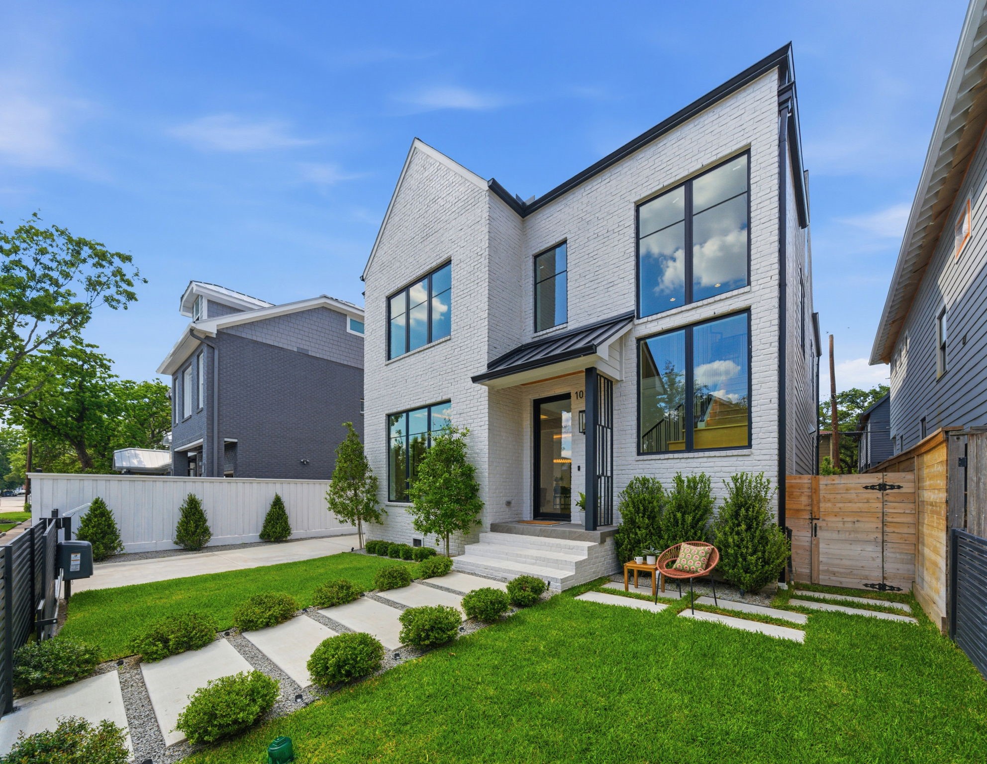 1023 Euclid Street Houston, TX 77009 - Photo 2 of 50 Welcoming front entry with lush landscaping, modern steel accents, and charming outdoor seating area.