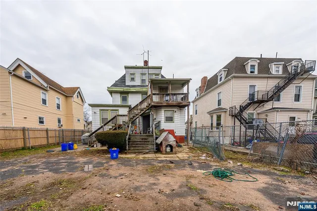 a bathroom with a sink mirror vanity and toilet