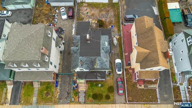 an aerial view of residential building and parking space