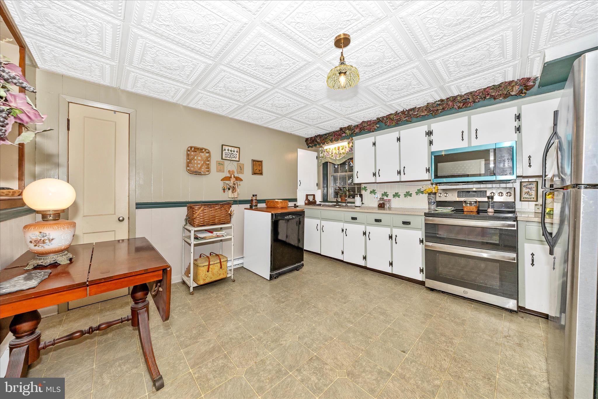 30 West Potomac Street Williamsport, MD 21795 - Photo 13 of 52 a kitchen with stainless steel appliances a stove cabinets and a refrigerator