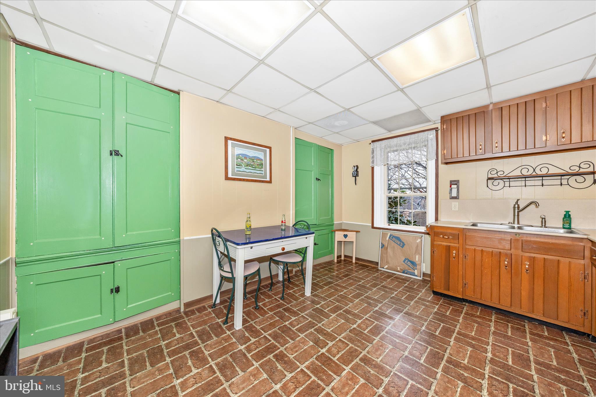 30 West Potomac Street Williamsport, MD 21795 - Photo 23 of 52 a room with window two chairs and a table