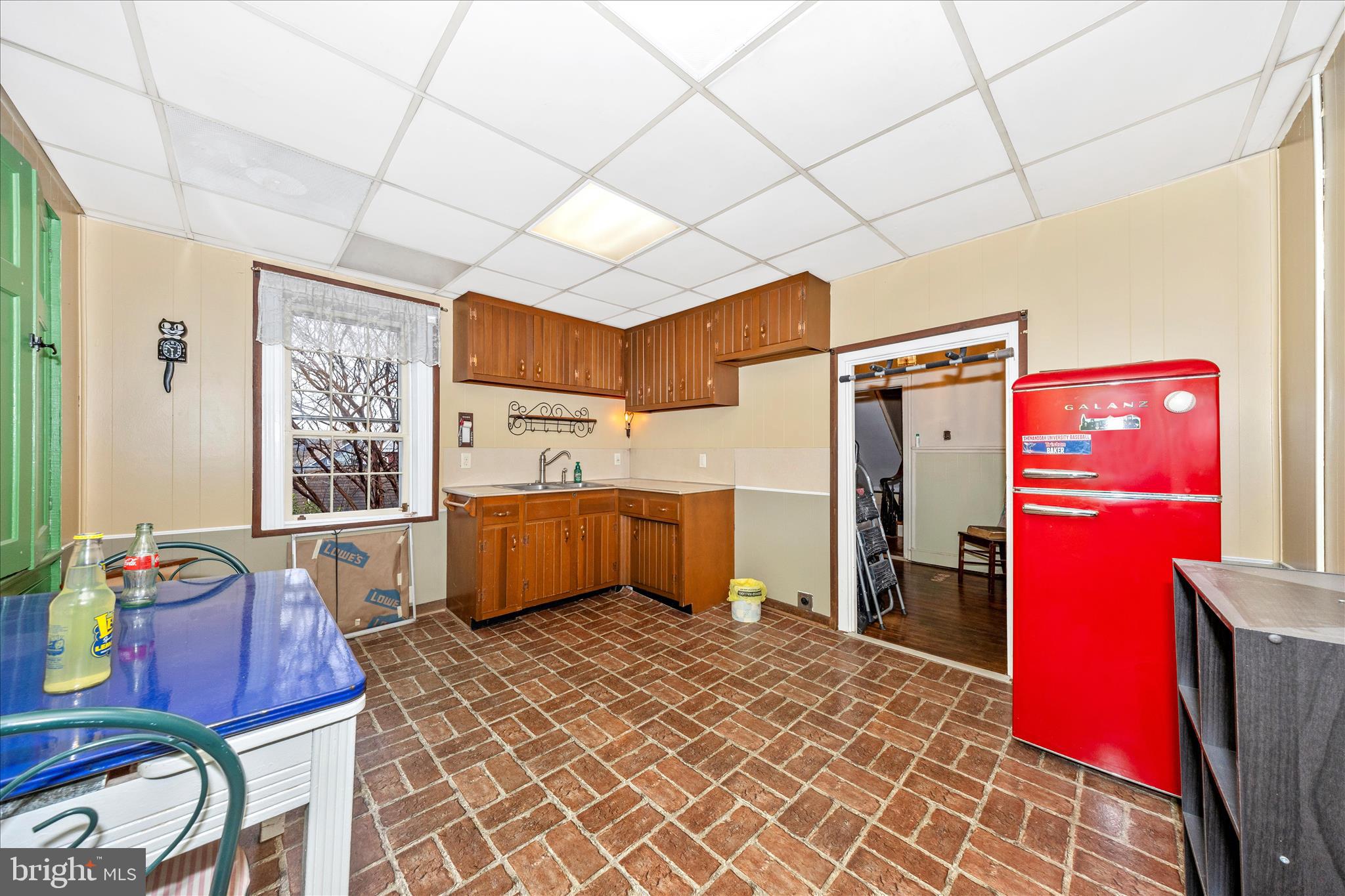 30 West Potomac Street Williamsport, MD 21795 - Photo 24 of 52 a utility room with stainless steel appliances wooden floors a rug and a window