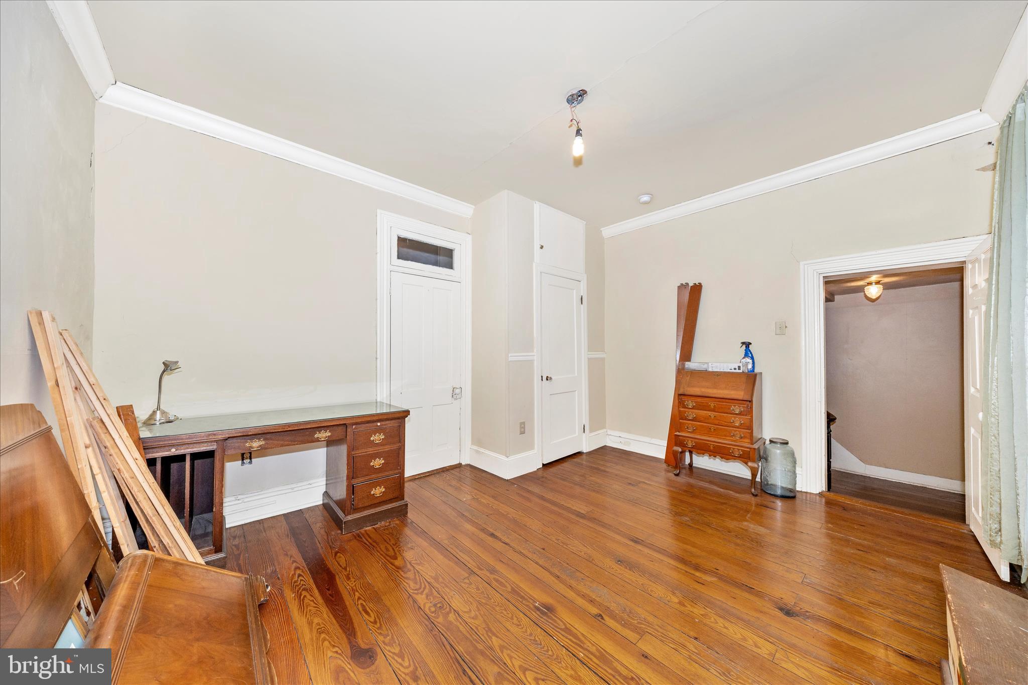 30 West Potomac Street Williamsport, MD 21795 - Photo 26 of 52 a view of an empty room with wooden floor and a window
