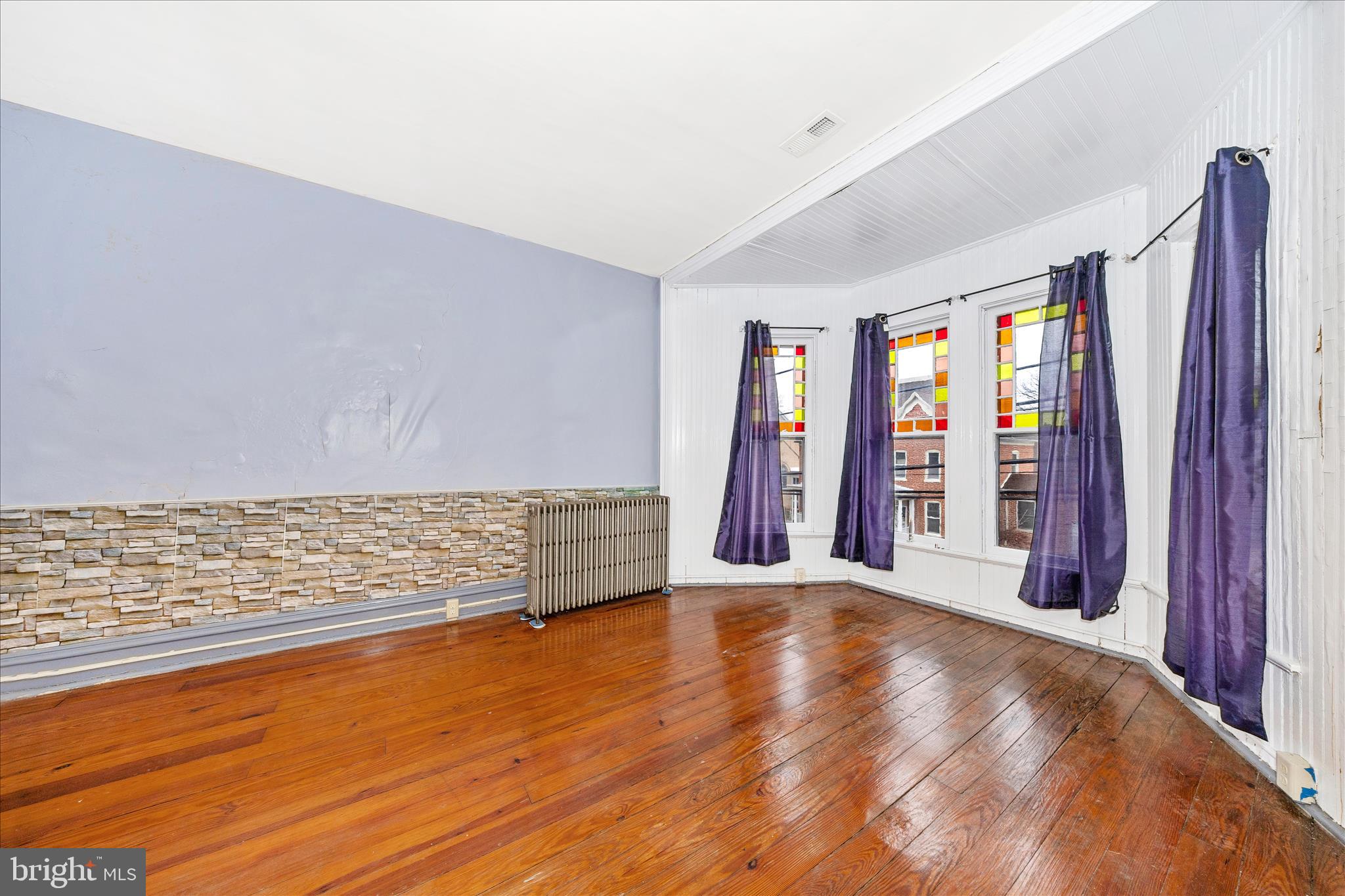 30 West Potomac Street Williamsport, MD 21795 - Photo 32 of 52 a view of an empty room with window and wooden floor