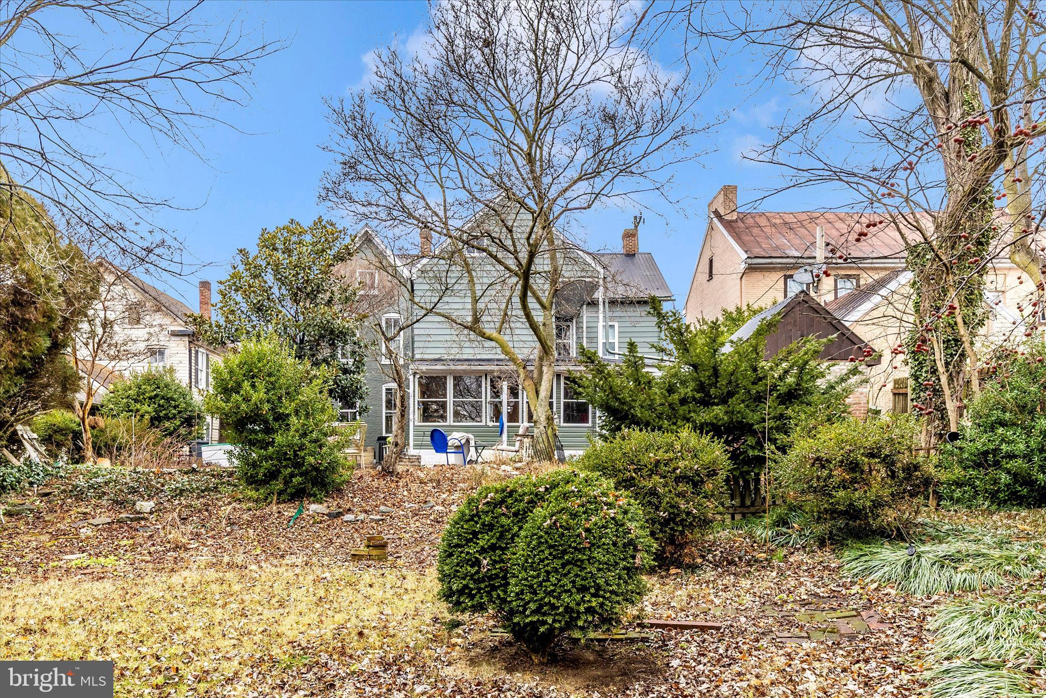 30 West Potomac Street Williamsport, MD 21795 - Photo 47 of 52 a front view of a house with a yard and trees