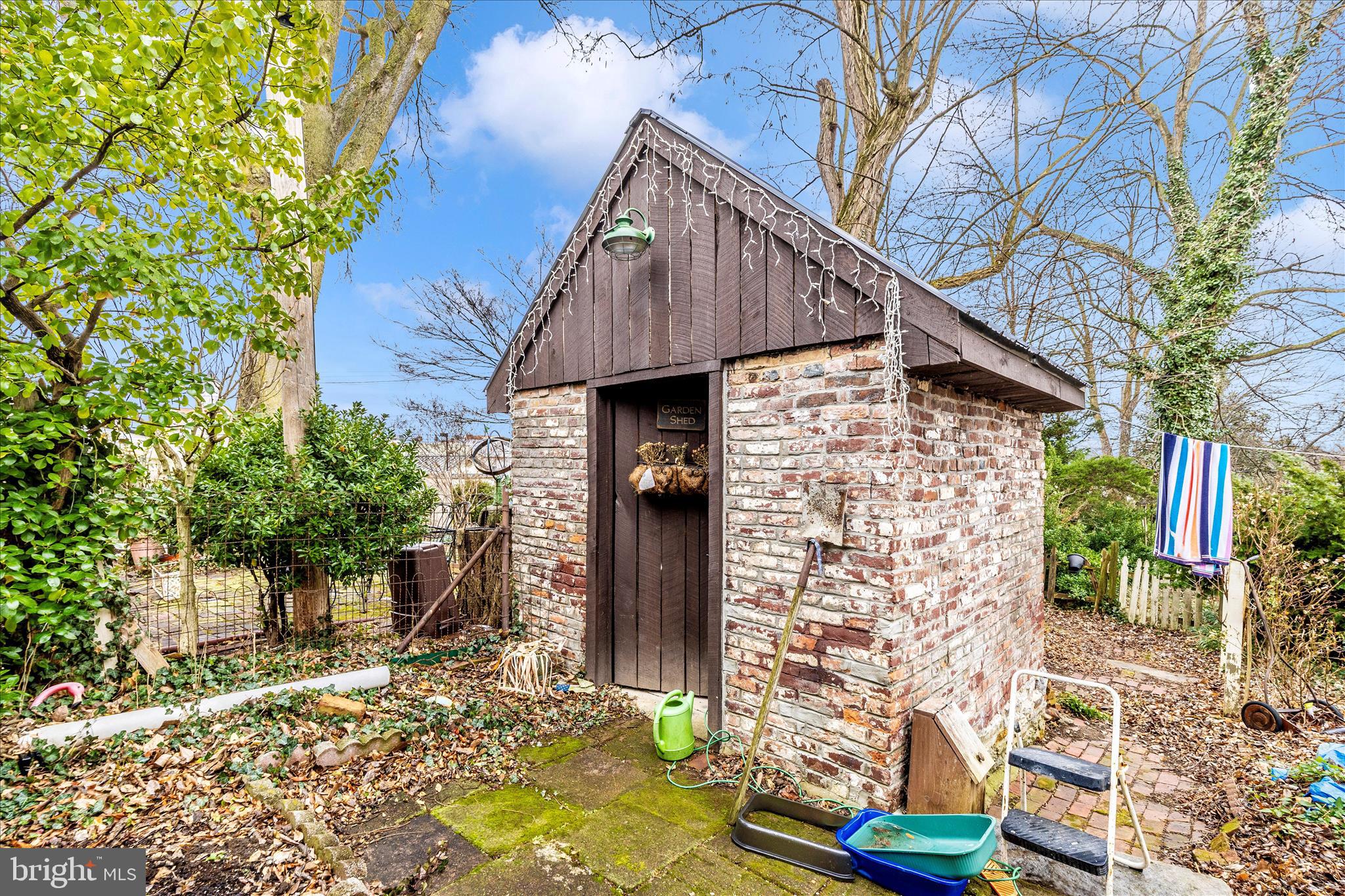 30 West Potomac Street Williamsport, MD 21795 - Photo 52 of 52 a view of a house with wooden fence and large trees