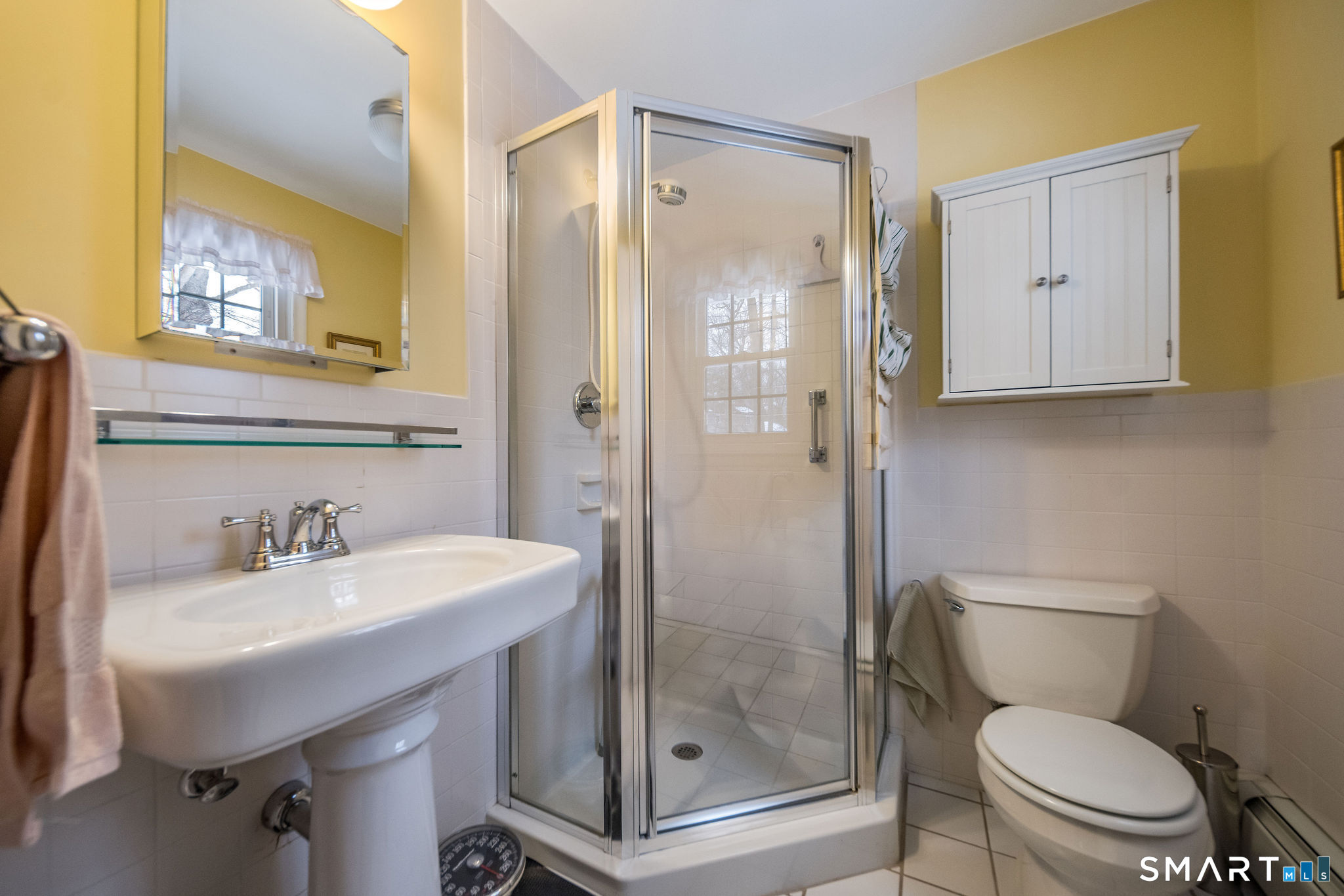 162 Yankee Peddler Path Madison, CT 06443 - Photo 17 of 39 a bathroom with a sink toilet and shower